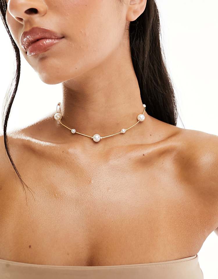 https://images.asos-media.com/products/asos-design-short-necklace-with-mixed-sized-faux-pearl-in-gold-tone/207039011-1-gold?$n_750w$&wid=750&fit=constrain