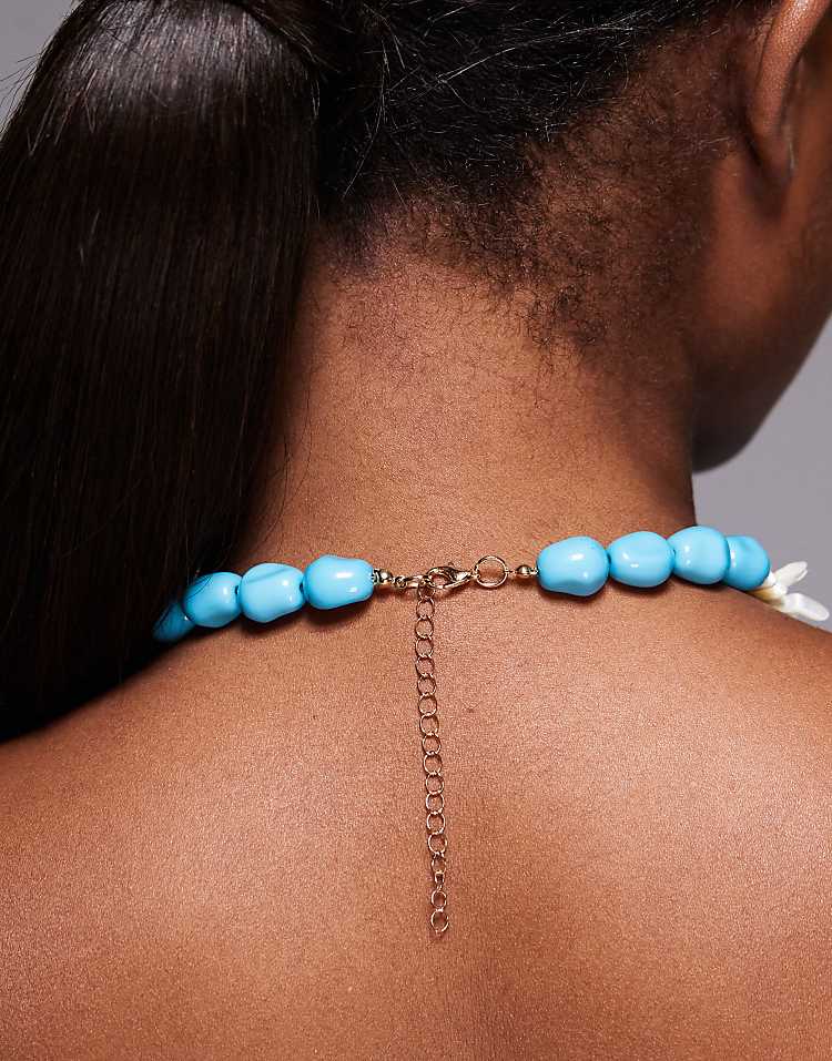 https://images.asos-media.com/products/south-beach-lotus-flower-chunky-beaded-necklace-in-blue/207354977-3?$n_750w$&wid=750&fit=constrain