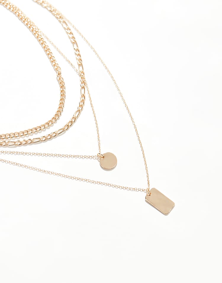 https://images.asos-media.com/products/pieces-multi-chain-necklace-with-charm-detail-in-gold/207423980-2?$n_750w$&wid=750&fit=constrain