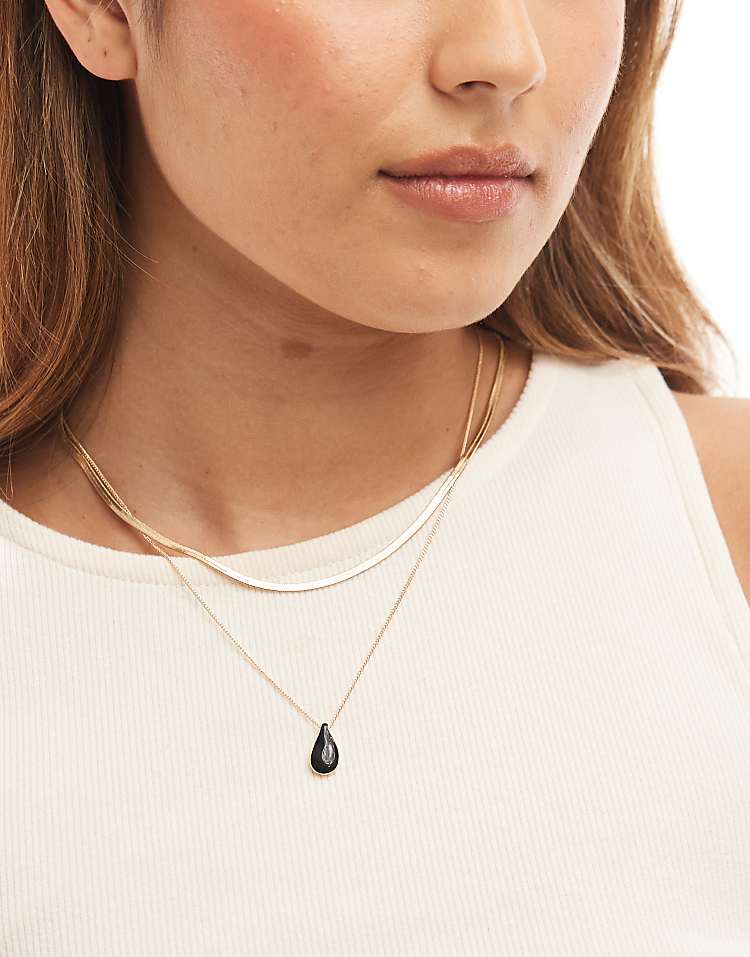 https://images.asos-media.com/products/asos-design-multirow-necklace-with-black-enamel-charm-pendant-in-gold-tone/207551207-1-gold?$n_750w$&wid=750&fit=constrain