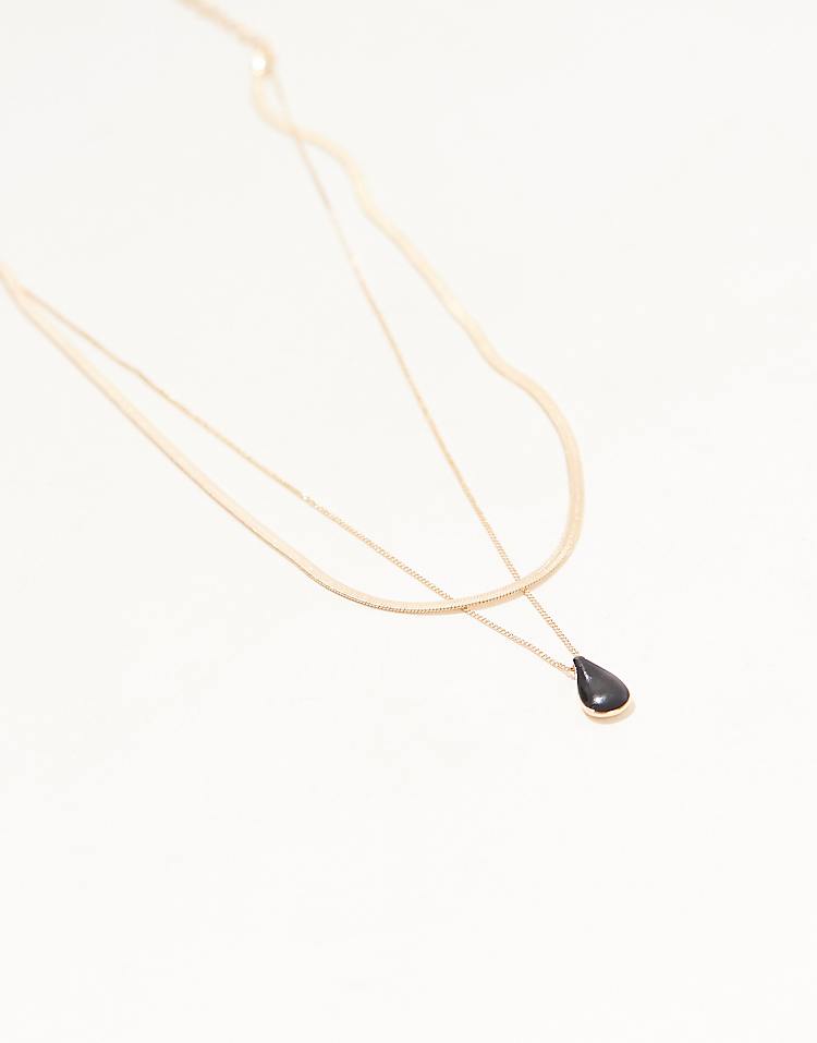 https://images.asos-media.com/products/asos-design-multirow-necklace-with-black-enamel-charm-pendant-in-gold-tone/207551207-3?$n_750w$&wid=750&fit=constrain