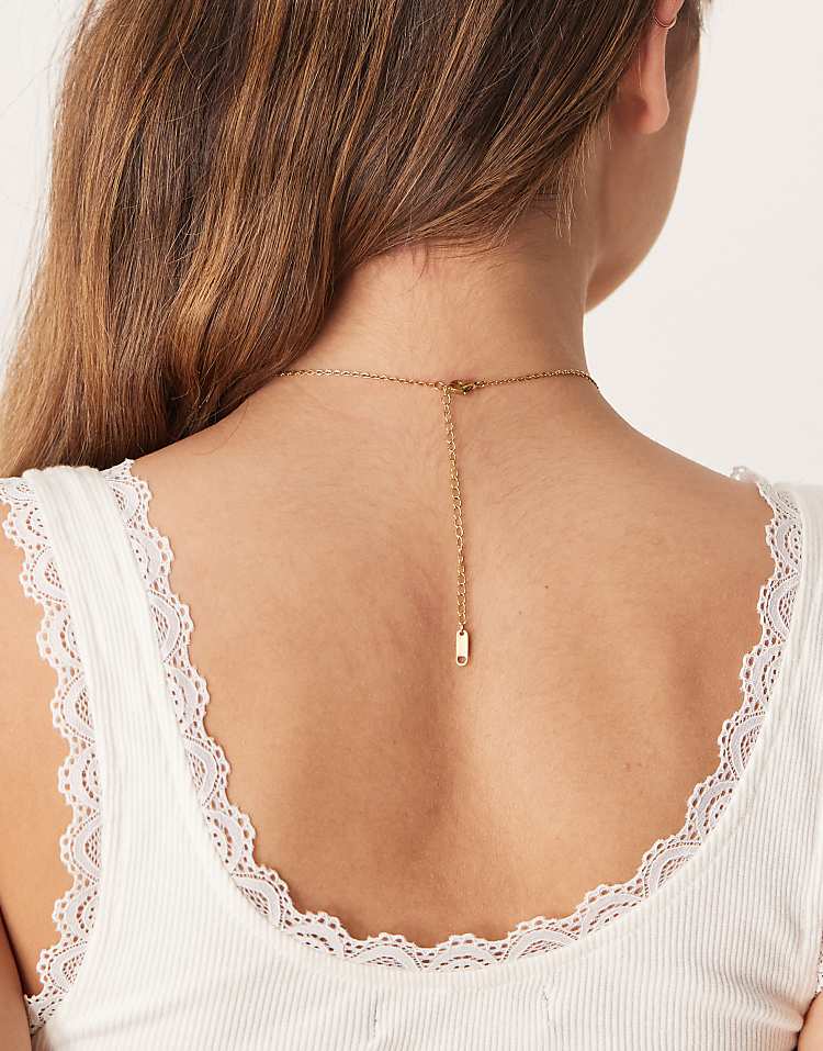 https://images.asos-media.com/products/lost-souls-stainless-steel-18ct-gold-plated-molten-coin-pendant-necklace-with-black-stone/207808865-3?$n_750w$&wid=750&fit=constrain