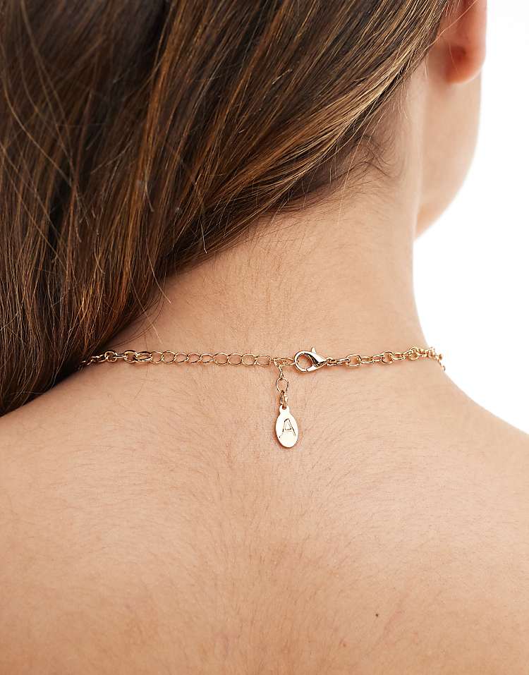 https://images.asos-media.com/products/accessorize-eclectic-shape-statement-necklace-in-gold/207856221-3?$n_750w$&wid=750&fit=constrain
