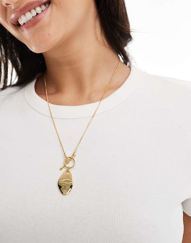https://images.asos-media.com/products/asos-design-14k-gold-plated-necklace-with-t-bar-and-molten-pendant/207950476-3?$n_750w$&wid=750&fit=constrain