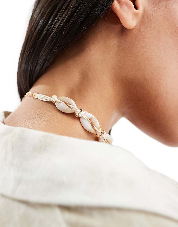 https://images.asos-media.com/products/asos-design-choker-necklace-with-faux-shell-design-in-neutral/208070411-3?$n_750w$&wid=750&fit=constrain