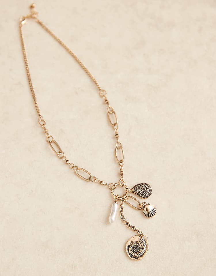 https://images.asos-media.com/products/asos-design-charm-necklace-with-fossil-pendant-in-worn-gold-tone/208187667-3?$n_750w$&wid=750&fit=constrain