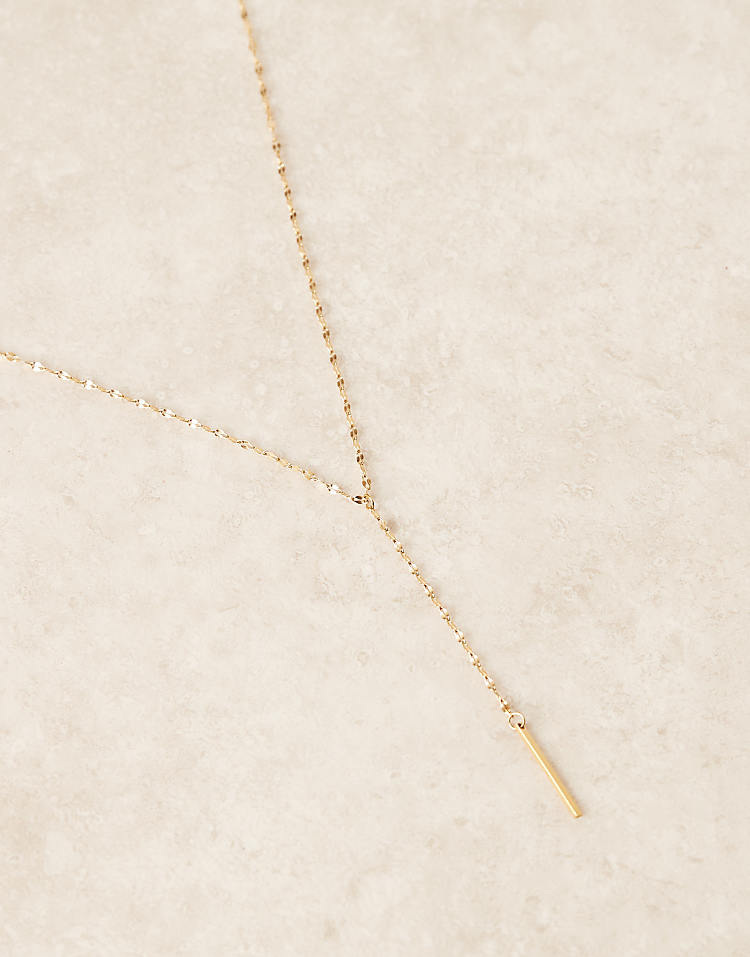 https://images.asos-media.com/products/lost-souls-simple-lariat-necklace-in-18ct-gold-plated-stainless-steel/208512626-2?$n_750w$&wid=750&fit=constrain
