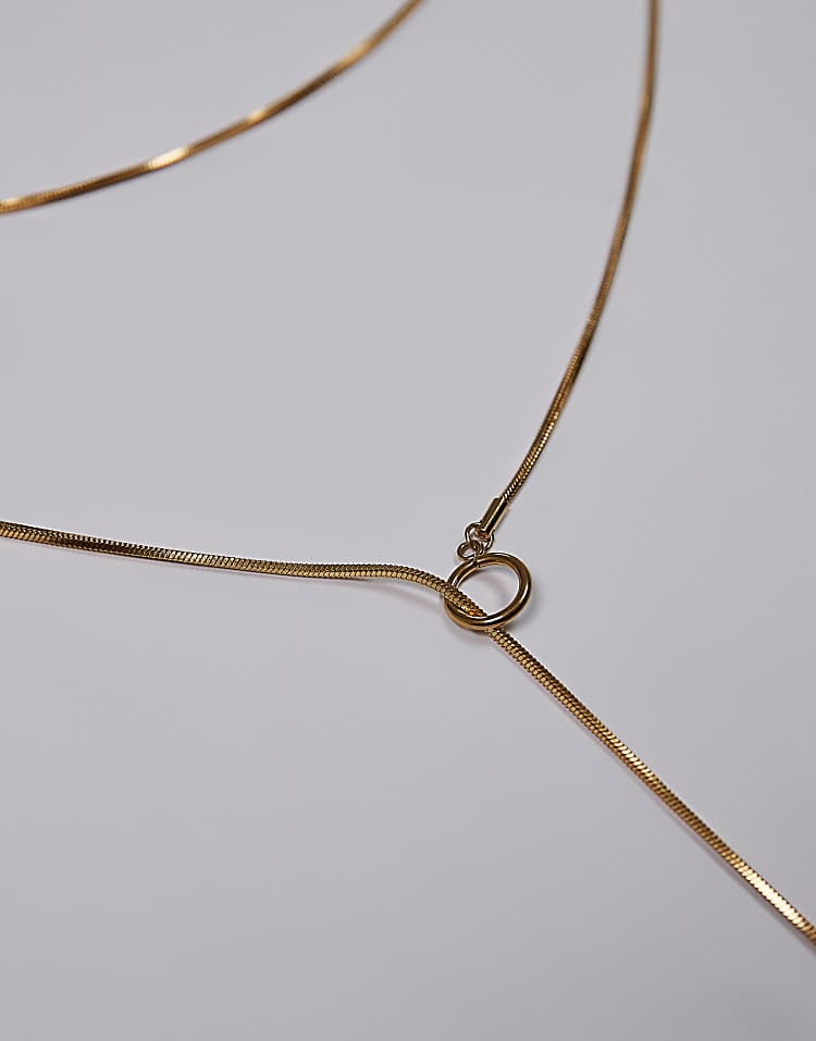 https://images.asos-media.com/products/topshop-samir-waterproof-stainless-steel-link-charm-necklace-in-gold/208532374-3?$n_750w$&wid=750&fit=constrain