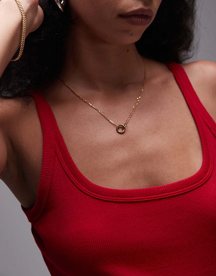 https://images.asos-media.com/products/topshop-seti-waterproof-stainless-steel-lariat-chain-necklace-in-gold/208532375-1-gold?$n_750w$&wid=750&fit=constrain