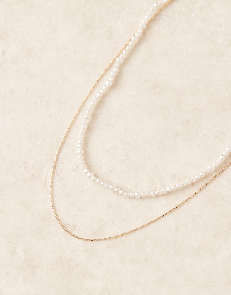 https://images.asos-media.com/products/asos-design-multi-row-short-necklace-with-faux-pearl-row-and-chain-in-gold-tone/208583194-2?$n_750w$&wid=750&fit=constrain