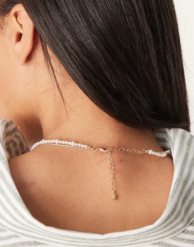 https://images.asos-media.com/products/asos-design-multi-row-short-necklace-with-faux-pearl-row-and-chain-in-gold-tone/208583194-3?$n_750w$&wid=750&fit=constrain
