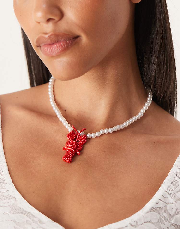 https://images.asos-media.com/products/asos-design-faux-pearl-necklace-with-lobster-pendant/208655261-1-fauxpearl?$n_750w$&wid=750&fit=constrain
