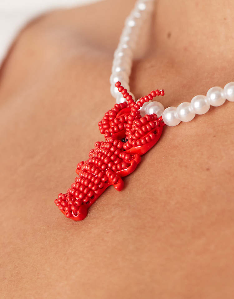 https://images.asos-media.com/products/asos-design-faux-pearl-necklace-with-lobster-pendant/208655261-3?$n_750w$&wid=750&fit=constrain