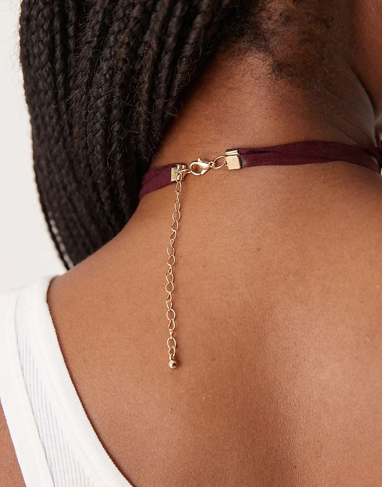 https://images.asos-media.com/products/asos-design-necklace-on-burgundy-ribbon-cord-with-large-sun-pendant-in-gold-tone/208789107-3?$n_750w$&wid=750&fit=constrain