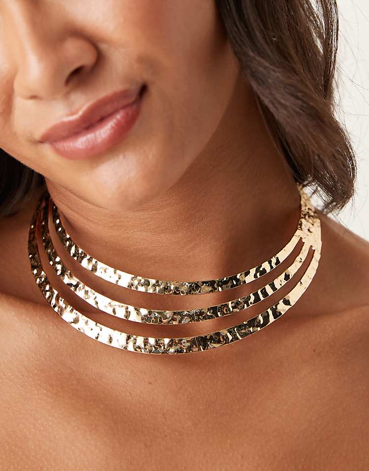 https://images.asos-media.com/products/asos-design-torque-choker-necklace-with-rows-in-hammered-gold-tone/208932553-1-gold?$n_750w$&wid=750&fit=constrain