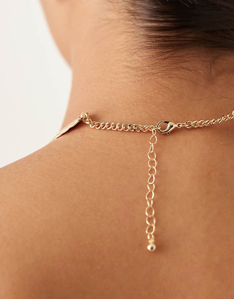 https://images.asos-media.com/products/asos-design-torque-choker-necklace-with-rows-in-hammered-gold-tone/208932553-3?$n_750w$&wid=750&fit=constrain